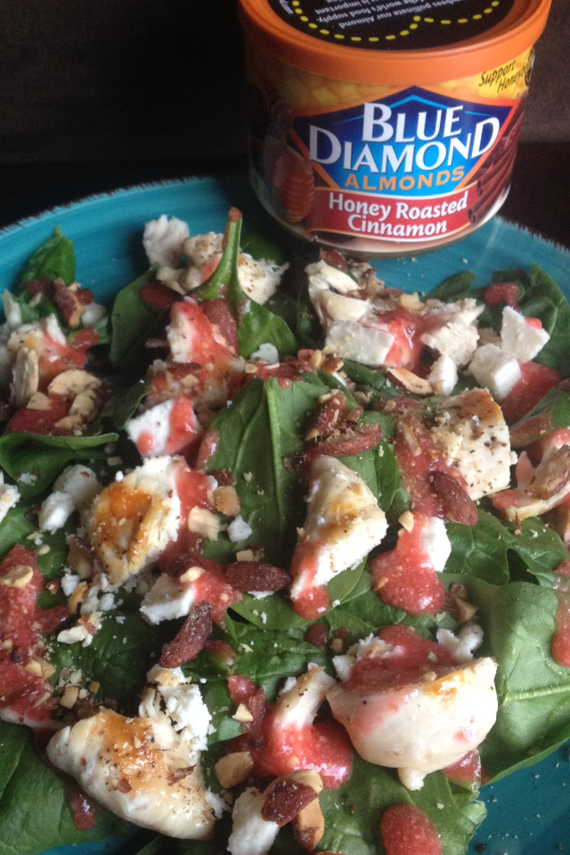 Spinach Salad with chicken, feta, blue diamond honey cinnamon almonds topped with fresh strawberry dressing
